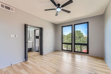 Unfurnished room with a ceiling fan, light wood-t