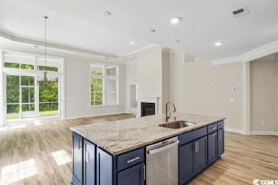 Kitchen with open floor plan, light wood-type floo