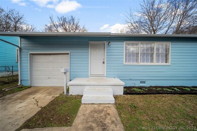 One car garage, new flower beds and fresh exterior