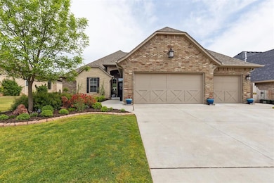 View of front of home featuring driveway, a garage