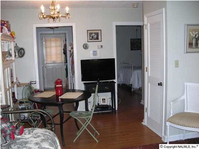 Living and dining room has recent wood laminate floor.