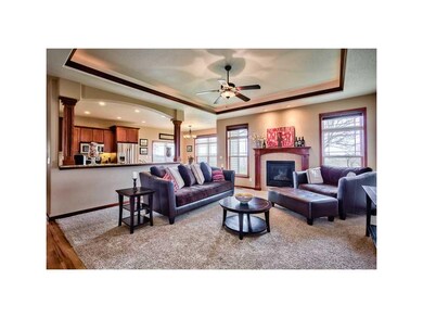 Great Room. GAS FIREPLACE WITH TILE SURROUND.