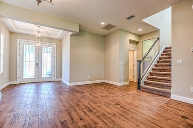 Foyer with trey ceiling, dining room
