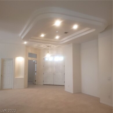 Overhead lights and coffered ceiling highlight the