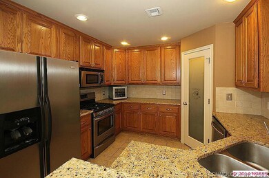 Kitchen with Granite Countertops and a pantry.