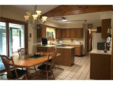 Kitchen. Open kitchen with large nook area.  Opens onto sun porch across rear of home.