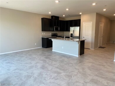Kitchen has granite counter tops with a island bre