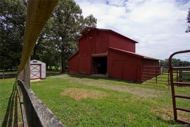 Well maintained five stall horse barn with hay lof