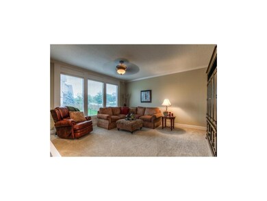 Large great room with a wall of windows and the am