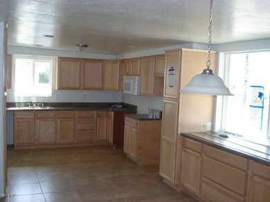 Kitchen with fresh tile and windows