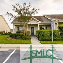 The low maintenance home has a covered front porch