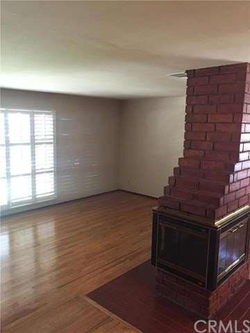 Living Room With Custom Wood Burning Fireplace