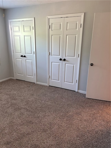 Unfurnished bedroom featuring carpet flooring and