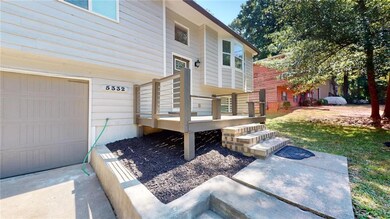 Rear view of property featuring a garage