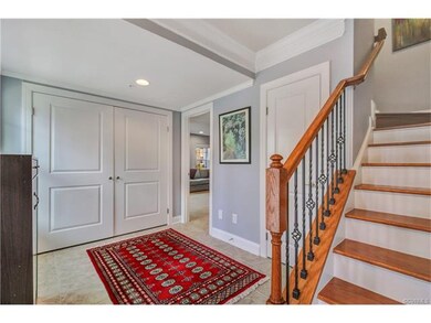 Beautiful wood stairs and wrought iron spindles