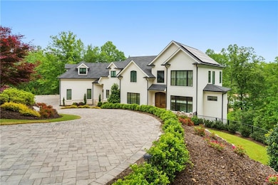 French country inspired facade featuring stucco si