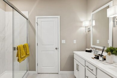Primary bath with glass shower enclosure