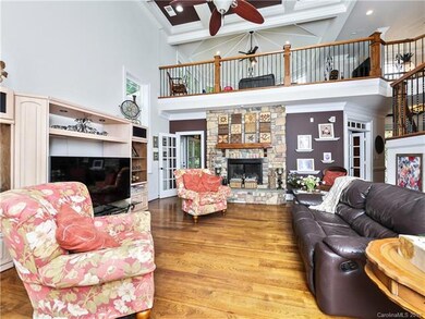 2-Story Great Room with hardwoods, coffered ceilin