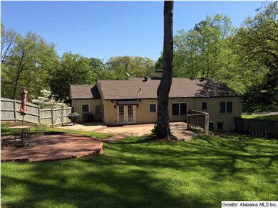 Amazing back yard with great trees and patios.