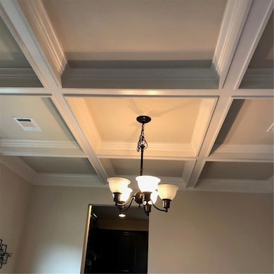 Interior details with crown molding, an inviting c