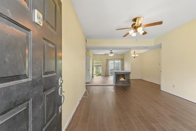 Step inside to sleek floors, and a warm fireplace