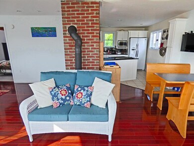 Open floor plan shows Kitchen off to...