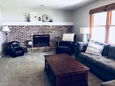 Family Room with gas fireplace - view from kitchen