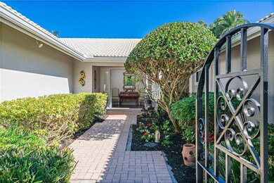 Beautifully landscaped walkway and courtyard to fr