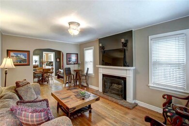 Be greeted by gorgeous hardwood floors and invitin