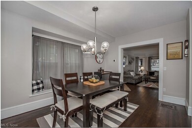 The dining room is open to the kitchen.  The window seat provides great natural light, and additional seating for guests.