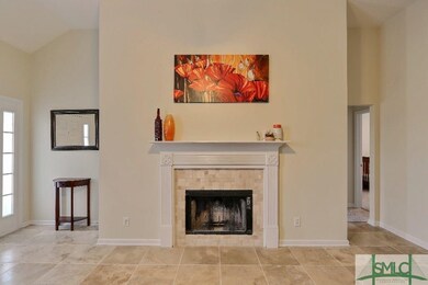 Tiled fireplace in living room.