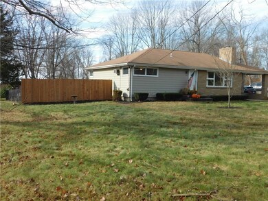 Bright and sunny, clapboard and stone front.