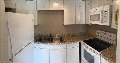Kitchen -- New cabinets, appliances, floor, and countertops.