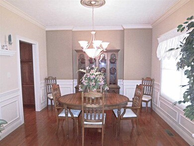 Gorgeous hardwood flooring, crown molding, and cha