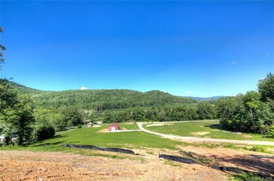 View of the property, shop, driveway, homesites and mountain views