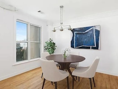 Dining space featuring baseboards and light wood-style flooring