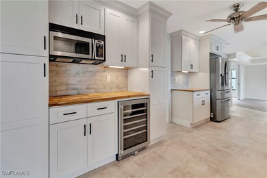 Kitchen with butcher block countertops, appliances