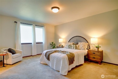 Spacious primary bedroom with walk in closet.