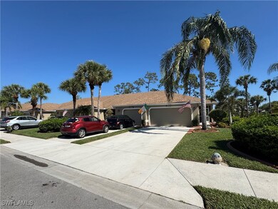 Single story home with a garage, a front lawn, and