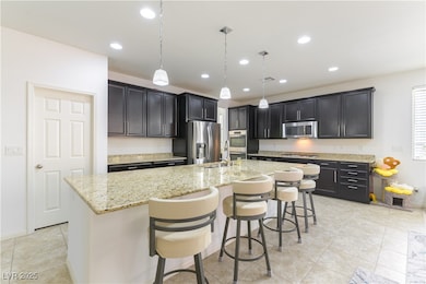 Kitchen featuring appliances with stainless steel