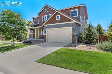 Craftsman inspired home with a garage and a front 