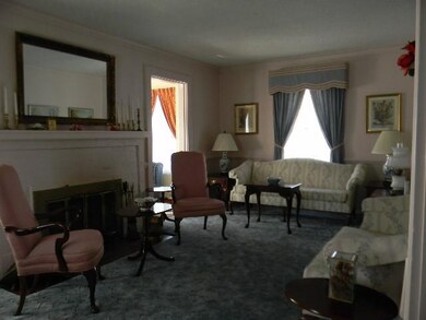 Living Room. With hardwood flooring under carpetin