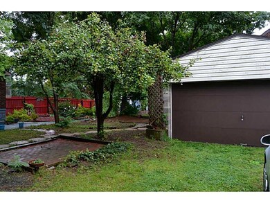 Exterior Back. 2 car detached garage with auto doo
