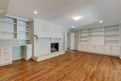 Bright and inviting den/living space—perfect for movie nights, game days, or your next cozy escape.