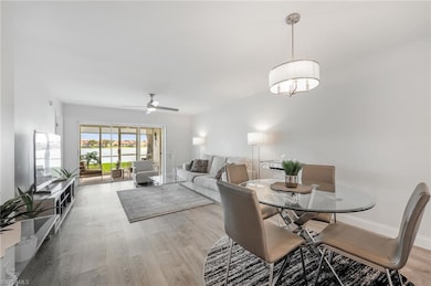 Dining room featuring light wood-style floors, ceiling fan, and baseboards