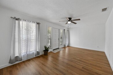 Unfurnished room with ceiling fan, a textured ceil