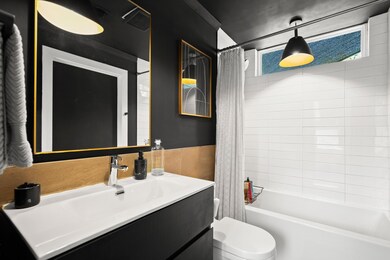 Bedroom with wood finished floors, a closet, and 