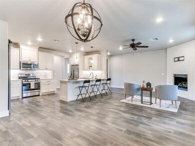 Kitchen with appliances with stainless steel finis
