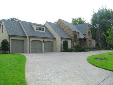 This home features a circle drive that leads to th