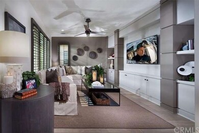 Family room is equipped with plantation shutters, 